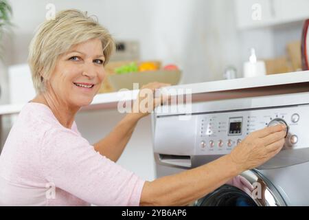 senior woman working in a laudry Stock Photo