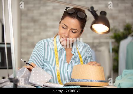 hat designer working in studio Stock Photo