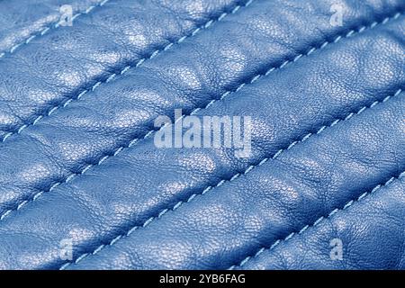 Macro shot leather texture background. Part of blue perforated leather details. Perforated leather texture background. Texture leather Stock Photo