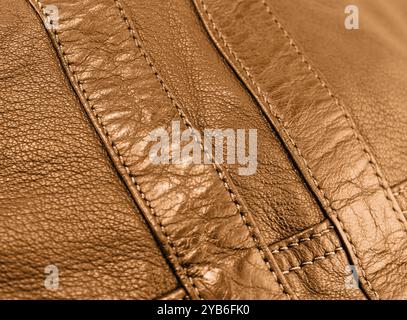 Macro shot leather texture background. Part of perforated brown leather details. Perforated leather texture background. Texture leather Stock Photo