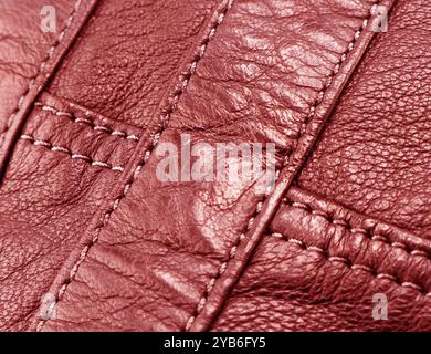 Macro shot leather texture background. Part of perforated red leather details. Perforated leather texture background. Texture leather Stock Photo