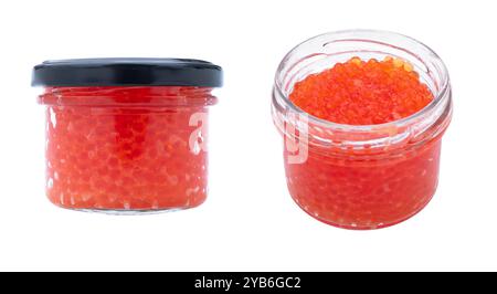 Red caviar in the glass jar isolated on a white background. Trout or salmon caviar close up. Macro shot. Stock Photo