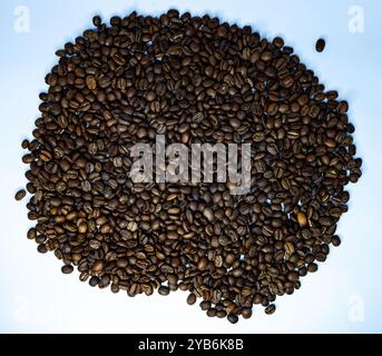 The coffee beans displayed on a plain white background. Stock Photo