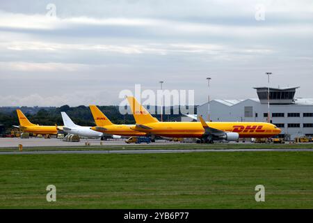 DHL Express hub at East Midlands Airport. Freighters on the tarmac. Stock Photo