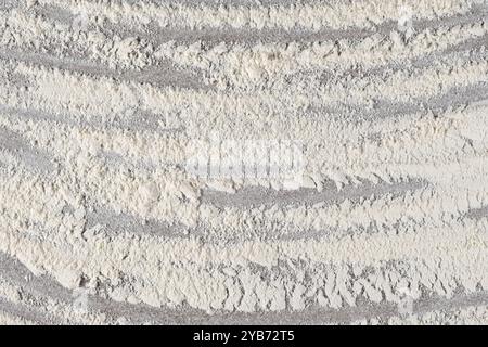 Grey cooking background of spilled wheat flour on stone background, top view Stock Photo