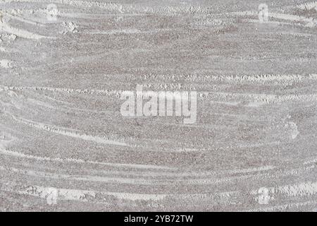 Grey cooking background of spilled wheat flour on stone background, top view. Stock Photo