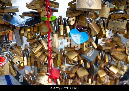 Love Locks on a bridge over the Naviglio Grande or Grand Canal in Milan Italy Stock Photo
