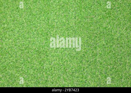 Artificial grass, covering. Artificial green grass mat, top view. Texture. Background. Artificial turf, surface made of synthetic fibers. Flat green g Stock Photo