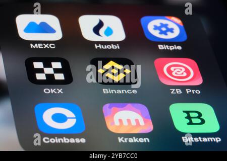 Binance, OKX, MEXC, Houbi, Coinbase, Bitpie, Kraken, ZB, Bitstamp app icons. Assorted cryptocurrency exchange platform company logos Stock Photo