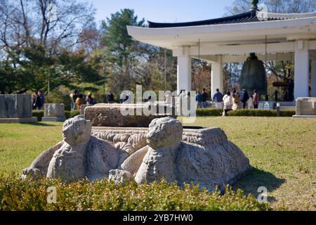 Gyeongju, South Korea - November 11th, 2023: Stone sculptures in the foreground complement the Emille Bell Pavilion in the background at the Gyeongju Stock Photo