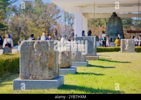 Gyeongju, South Korea - November 11th, 2023: A row of ancient stone carvings from the Silla dynasty is displayed at Gyeongju National Museum, with the Stock Photo