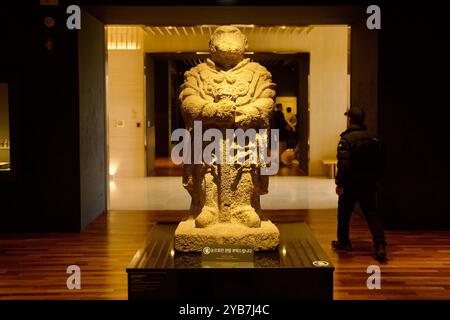 Gyeongju, South Korea - November 11th, 2023: An ancient stone statue from the Silla dynasty is prominently displayed inside Gyeongju National Museum, Stock Photo