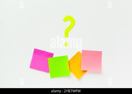 sticky notes with question marks over white Stock Photo