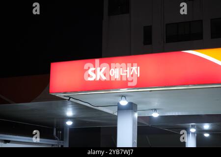 Jeju, South Korea-May 23rd 2024: SK Energy company brand logo at night Stock Photo