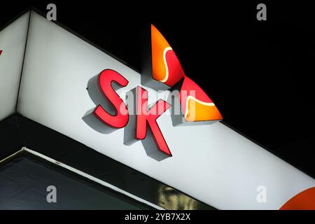 Jeju, South Korea-May 23rd 2024: SK Group company brand logo at night Stock Photo