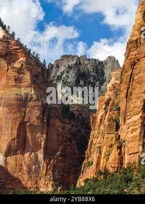 The Great White Throne, one of iconic mountain peaks in Zion National, Utah, USA, peaking out between two steep sandstone cliffs along the Canyon rim Stock Photo