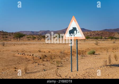 Elephant crossing, wildlife road sign and Damaraland landscape in Namibia, Africa Stock Photo