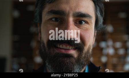 Close up Caucasian mature man senior male guy smiling businessman client eyes looking camera friendly happy eyesight good vision home business office Stock Photo