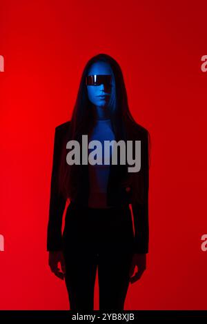 Cyberpunk portrait in Futuristic Modern Young Woman with Smart Glasses Standing a Red Glowing Background, Metaverse digital cyber world technology Stock Photo
