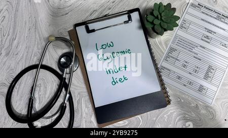 Concept of Low Glycemic Index Diet write on paperwork isolated on wooden background. Stock Photo