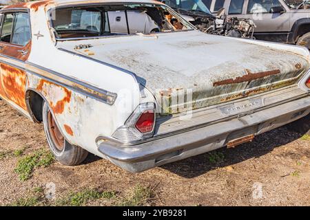 Yoakum, Texas, United States. March 17, 2022. An old rusted Chrysler car in a Texas junkyard. Stock Photo