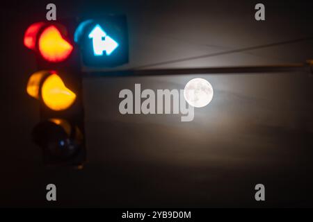 Prague, Czech Republic. 17th Oct, 2024. Supermoon seen with traffic lights in the Czech capital Prague. October's full moon, also known as the Hunter's Moon is biggest and brightest supermoon in this year. Credit: SOPA Images Limited/Alamy Live News Stock Photo