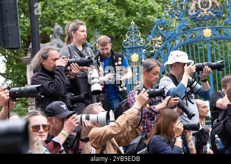 London, UK. 22nd June 2024. Group of press photographers gathered together, at an advantageous shooting location during a protest demonstration through the streets of central London. Stock Photo