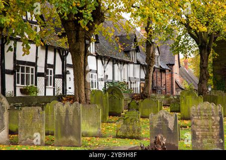 Autumn view along an the old  picturesque School Lane in the Cheshire village of Great Budworth from the churchyard of Saint Mary's  and all Saints Stock Photo