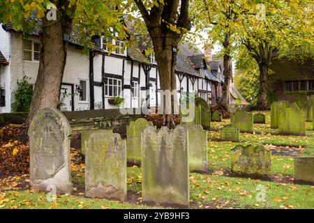 Autumn view along an the old  picturesque School Lane in the Cheshire village of Great Budworth from the churchyard of Saint Mary's  and all Saints Stock Photo