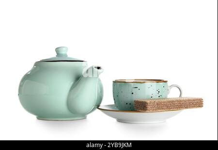 Ceramic teapot with cup and waffle on white background Stock Photo