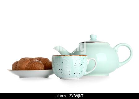 Ceramic teapot with cup and croissants on white background Stock Photo