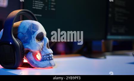 Extreme close up of software interface on PC screens showing lines of code running in empty criminals den. Hacking malware programming script on displays in underground base, handheld camera shot Stock Photo