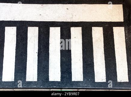 Zebra crossing on surface asphalt floor outside Stock Photo