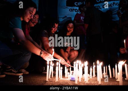 Buenos Aires, Argentina. 16th Oct, 2024. Students seen lighting candles after the march in front of the Ministry of Education. Amid the escalating conflict between the government and public universities, student unions from the University of Buenos Aires (UBA) held a torchlight march from Plaza Houssay to the Pizzurno Palace, the headquarters of the Ministry of Education, ''in defense of free, quality public universities.'' They were joined by unions representing teachers and graduates. (Credit Image: © Santi Garcia Diaz/SOPA Images via ZUMA Press Wire) EDITORIAL USAGE ONLY! Not for Commerci Stock Photo