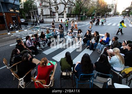 Buenos Aires, Argentina. 16th Oct, 2024. Students participate in a public class on Avenida CÃ³rdoba, during the demonstration. Amid the escalating conflict between the government and public universities, student unions from the University of Buenos Aires (UBA) held a torchlight march from Plaza Houssay to the Pizzurno Palace, the headquarters of the Ministry of Education, ''in defense of free, quality public universities.'' They were joined by unions representing teachers and graduates. (Credit Image: © Santi Garcia Diaz/SOPA Images via ZUMA Press Wire) EDITORIAL USAGE ONLY! Not for Commerci Stock Photo