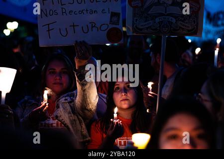 Buenos Aires, Argentina. 16th Oct, 2024. Students march with candles at night during the demonstration. Amid the escalating conflict between the government and public universities, student unions from the University of Buenos Aires (UBA) held a torchlight march from Plaza Houssay to the Pizzurno Palace, the headquarters of the Ministry of Education, ''in defense of free, quality public universities.'' They were joined by unions representing teachers and graduates. (Credit Image: © Santi Garcia Diaz/SOPA Images via ZUMA Press Wire) EDITORIAL USAGE ONLY! Not for Commercial USAGE! Stock Photo