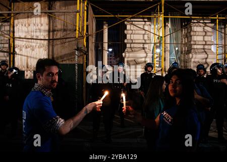 Buenos Aires, Argentina. 16th Oct, 2024. Students seen lighting candles after the march in front of the Ministry of Education. Amid the escalating conflict between the government and public universities, student unions from the University of Buenos Aires (UBA) held a torchlight march from Plaza Houssay to the Pizzurno Palace, the headquarters of the Ministry of Education, ''in defense of free, quality public universities.'' They were joined by unions representing teachers and graduates. (Credit Image: © Santi Garcia Diaz/SOPA Images via ZUMA Press Wire) EDITORIAL USAGE ONLY! Not for Commerci Stock Photo