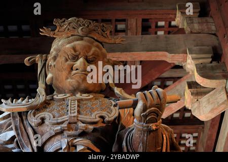 A closed up view of wooden statue of Komokuten in the Great Buddha Hall (daibutsuden) in Todaiji Temple (Eastern Great Temple).Nara.Japan Stock Photo