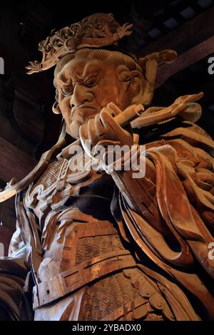 A closed up view of wooden statue of Komokuten in the Great Buddha Hall (daibutsuden) in Todaiji Temple (Eastern Great Temple).Nara.Japan Stock Photo