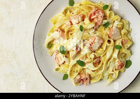 Tagliatelle pasta, in cream sauce with salmon, homemade, no people Stock Photo