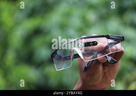 Glasses equipped with eye blink sensor module. Electronic component that can detect the blinking of eyes Stock Photo