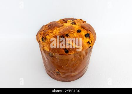 A whole Italian Panettone Christmas cake isolated on a white background. Stock Photo