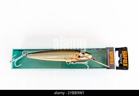 Lefkada, Greece- 10.04.2024. An open water trolling fishing lure and its package by the company Rapala isolated on white. Stock Photo