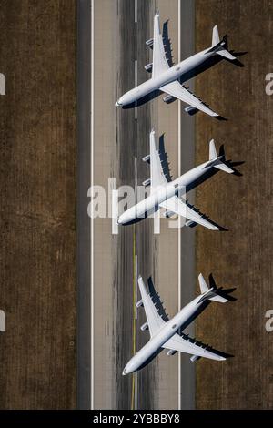 View from above airplanes parked on sunny airport runway Stock Photo