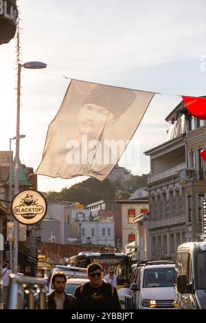 Istanbul, Turkiye - OCT 14, 2024: Large Turkish flags and Ataturk posters hanging in Ortakoy in Besiktas, Istanbul. Stock Photo