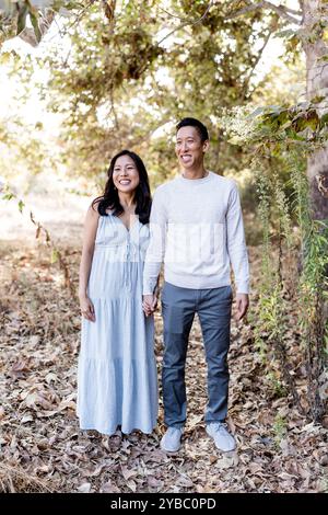 Happy Couple Standing in Park on Sunny Day in San Diego Stock Photo