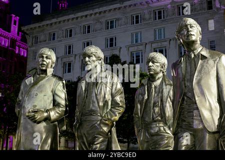 Statue of the Beatles by Andrew Edwards, photographed at night, Pier Head, Liverpool. Stock Photo