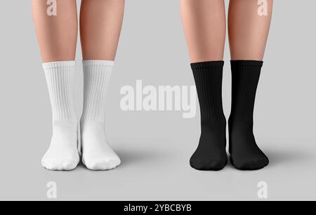 Mockup of black, white long socks with elastic band on female legs, front view, isolated on background with shadows. High ankle gaiters template for d Stock Photo