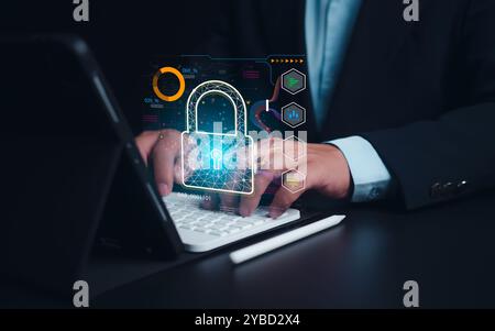 Businessman showing key and network security represents protection against cyber attacks and online hacking, Protection against external hacks, Cybers Stock Photo
