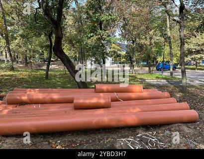 Plastic pipes at the road construction site in the woods Stock Photo